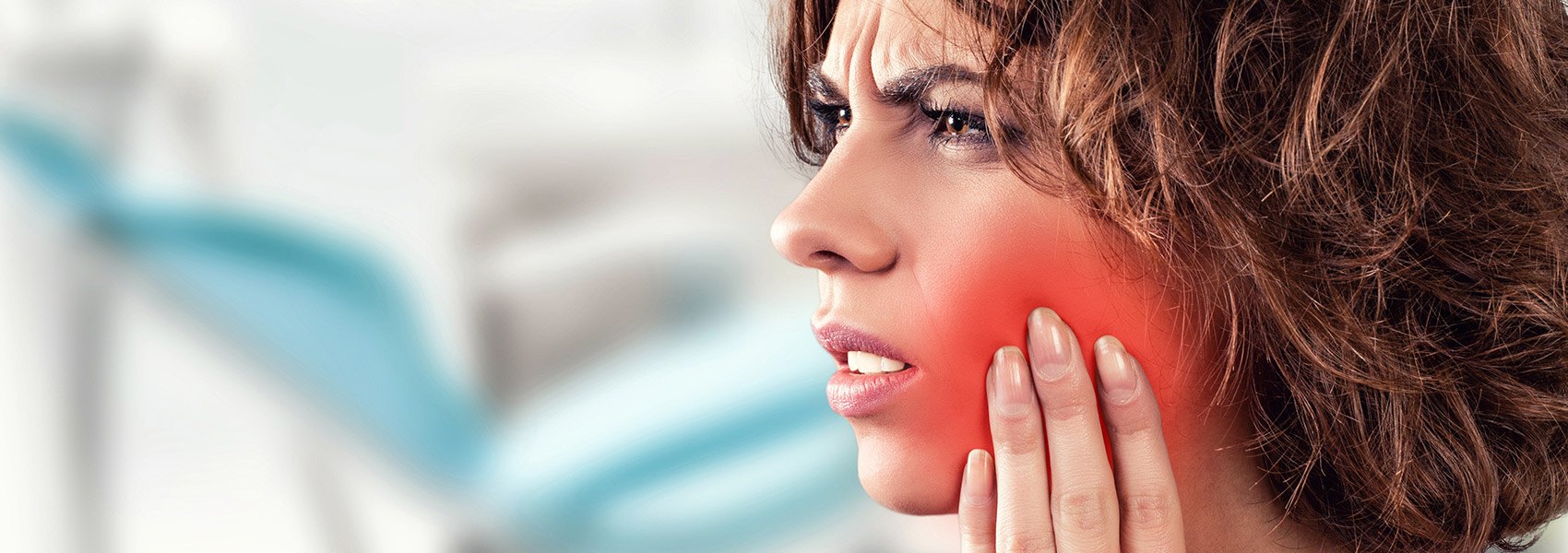Woman in tooth pain